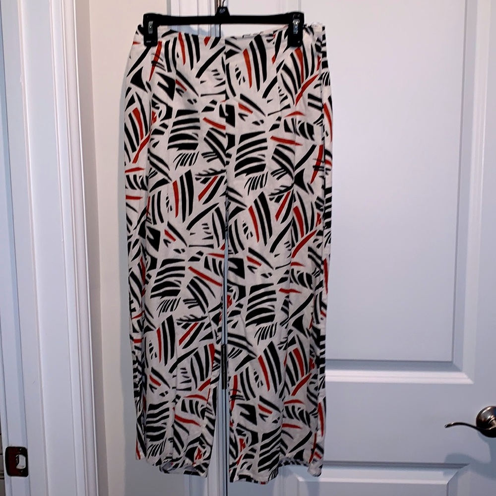 White pants with black and orange pattern by Mi Ami